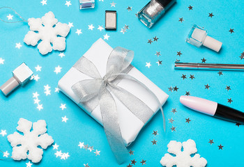 Christmas present set: decorative cosmrtic and gift box with festive decor. top view, flat lay