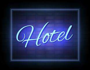 Hotel neon sign on brick wall