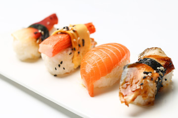 assorted sushi on white plate isolated on white back ground
