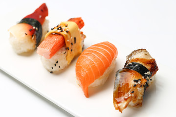 assorted sushi on white plate isolated on white back ground