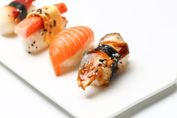 assorted sushi on white plate isolated on white back ground