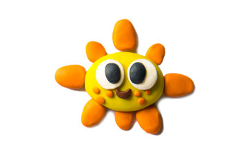 Modeling sun of plasticine. Photo illustration.