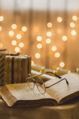 Holy bible book with eyeglasses