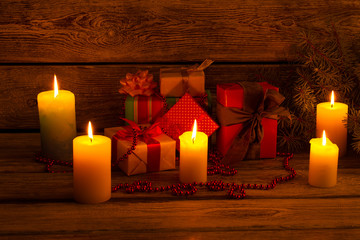 Lighted candles, gifts and ornaments