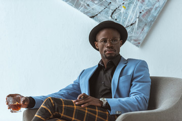 handsome man with cigar and whiskey