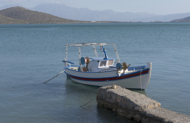 Small boat on the Merabello Gulf at Elounda, northern Crete, Greece,