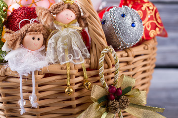 Christmas ornaments in wicker basket