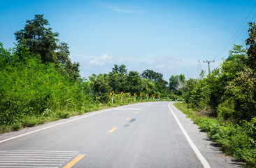 Asphalt road and view of forest,selective focus.