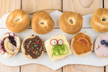 Fresh mini bagels with assorted cream cheese.