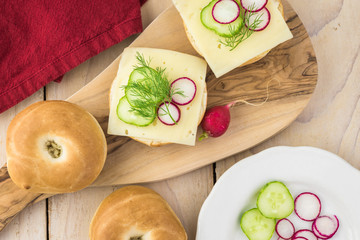 Fresh mini bagel sandwich with swiss cheese.