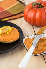 Fresh mini bagels with pumpkin spice cream cheese.