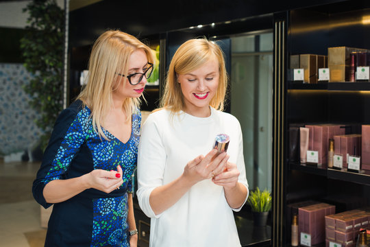 blonde woman in store cosmetics