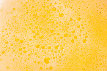 Close up of beer bubbles and foam as a background