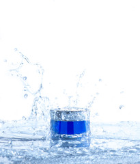 Cream pot drop and water splash. Concept beauty and felling fresh