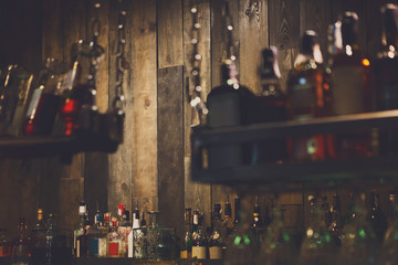 Bar background, wooden wall and drinks