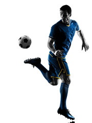 Naklejka premium one caucasian soccer player man playing in silhouette isolated on white background