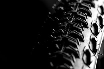 Bicycle wheel and tire close up on tread abstract