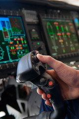 Close Up Pilot Holding Joystick In Helicopter Cockpit © highwaystarz