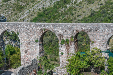 Fototapeta na wymiar Remains of aqueduct in Stari Bar village near Bar city in Montenegro