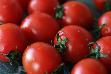 Fresh bright and juicy tomatoes on the kitchen