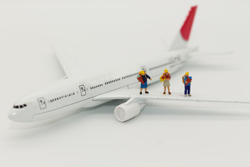 miniature children, travel by plane for travel. using as business background concept.