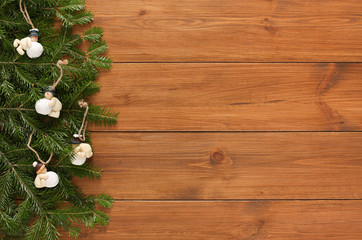 Obraz na płótnie Canvas Christmas tree branches and ornaments border background