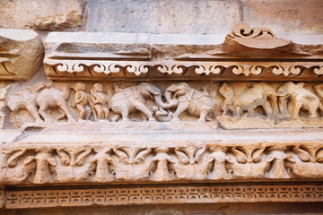 Ancient bas-relief at famous erotic temple in Khajuraho, India.