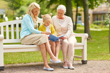 woman with daughter and senior mother at park