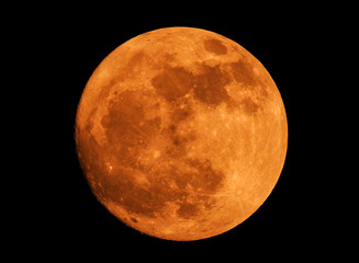 The yellow full moon on black background