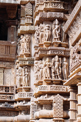 Ancient bas-relief at famous erotic temple in Khajuraho, India.
