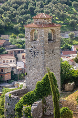 Fototapeta na wymiar Tower clock among ruins of Stari Bar fortress near Bar city in Montenegro