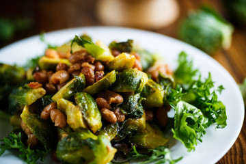 Brussels sprouts fried with beans close-up