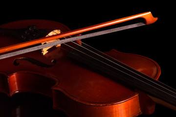 Fototapeta na wymiar Violin and bow isolated on black
