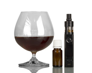 Glass of whiskey and an electronic cigarette, bottle with fragrant liquid, isolated on white