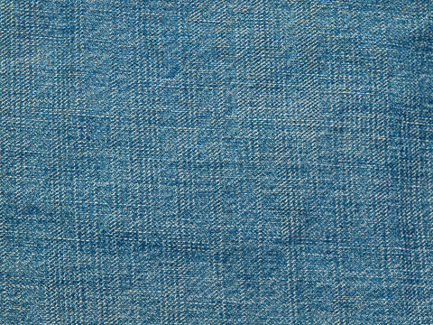 Blue denim textile texture.