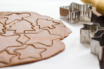 Gingerbread dough and forms in shape of stars / Preparation to Christmas dinner