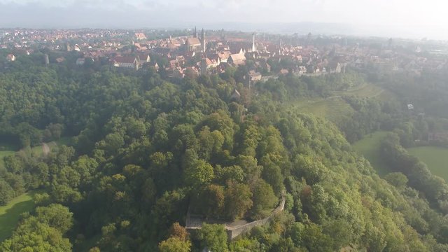 aerial drone flying over rothenburg ob er tauber 4k green landscape