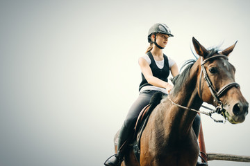 Obraz premium Picture of young girl riding her horse