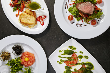 Set of classic national snacks using meat, salmon and fresh vegetables