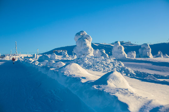 Beautiful cold mountain view of ski resort, sunny winter day with slope, piste and ski lift