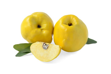 Two quince fruits with a slice