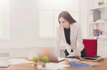 Business woman working on laptop at office
