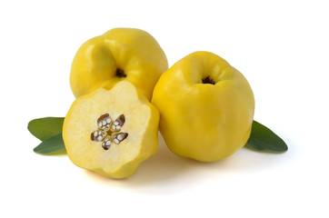 Two quince fruits with a half. Transverse cut