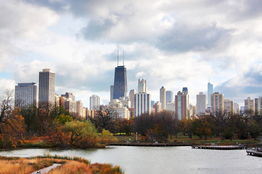 Urban cityscape and modern architecture background.Chicago downtown skyline from Lincoln Park Neighborhood located at the Lincoln Park Zoo. Autumn cityscape with cloudy sky over skyscrapers. 
