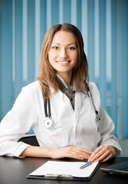 Cheerful female doctor at office