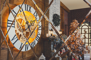Cozy christmas interior with fir tree and fireplace reflecting i