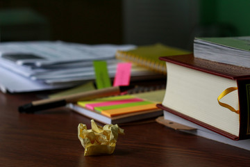 screwed up the paper note colorful sheet and books props