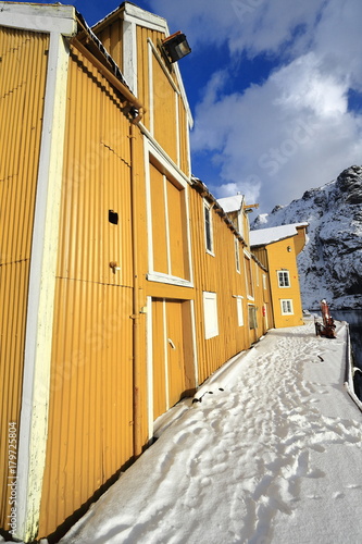 Wooden Port Warehouse Painted Yellow Closed Doors And Windows