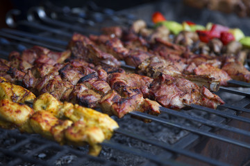 Different kinds of meat and vegetables on skewers