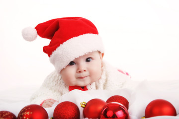Beautiful girl in Christmas costume with Christmas balls toys. In Studio on white background isolated